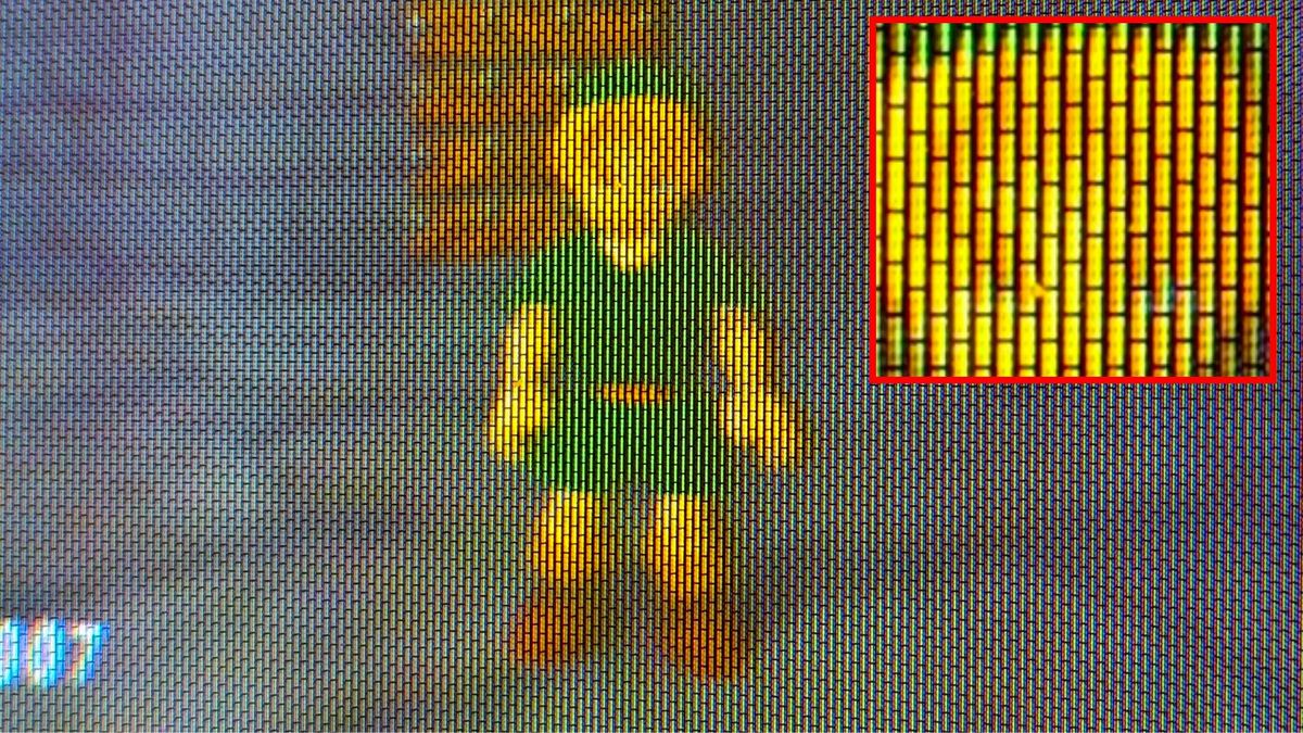 Close-up of a five-inch CRT screen with Zelda Ocarina of Time Link sprite on screen and red square on the right with a zoomed-in shot of the shadow mask pattern and delta/traid phosphors.