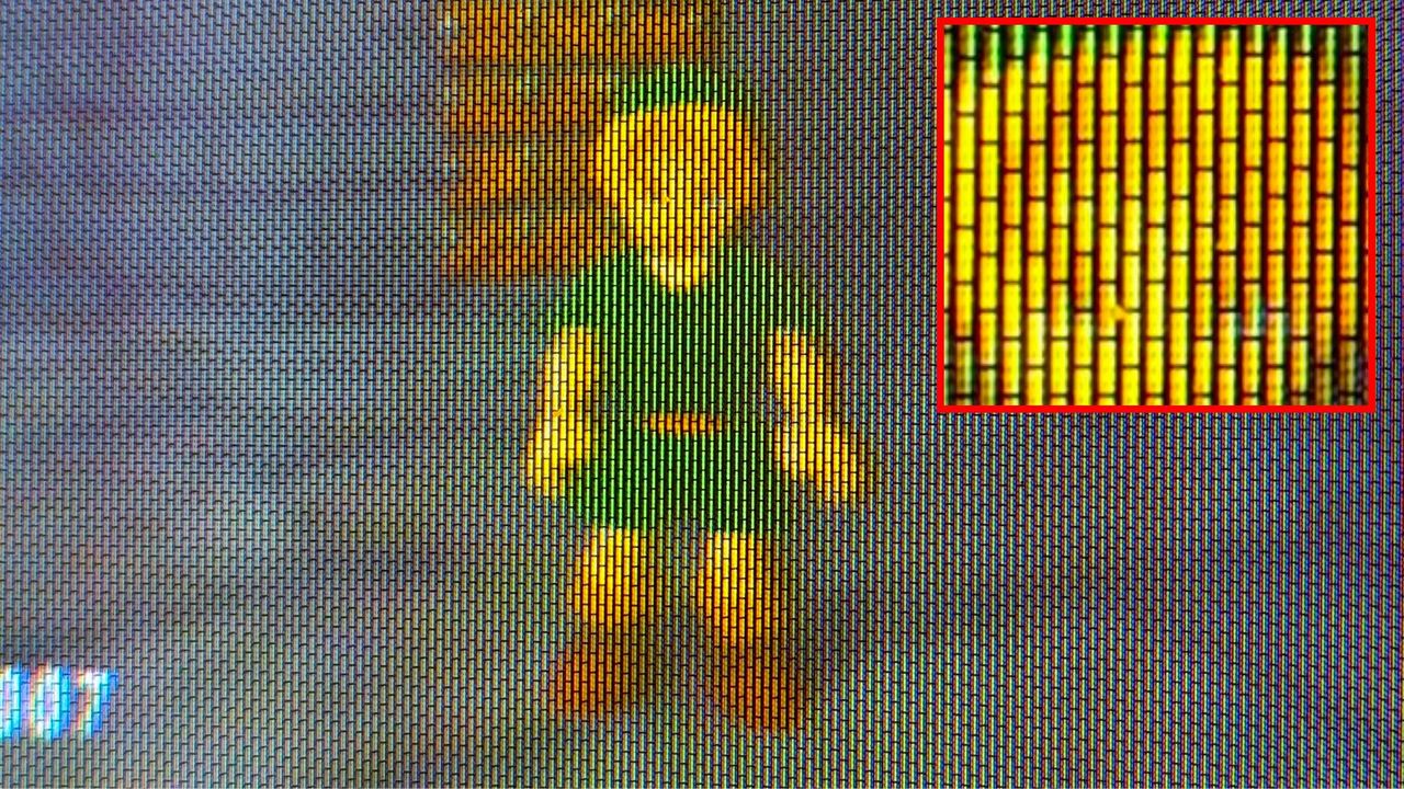 Close-up of a five-inch CRT screen with Zelda Ocarina of Time Link sprite on screen and red square on the right with a zoomed-in shot of the shadow mask pattern and delta/traid phosphors.