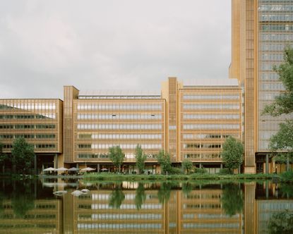 walking through Potsdamer Platz in Berlin and its postmodernist architecture, showing large scale buildings with transparencies and grids