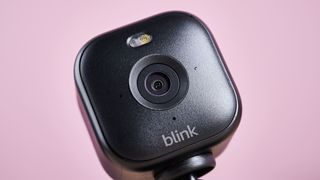 A close-up of the front of the Blink Mini 2, showing the camera and spotlight.