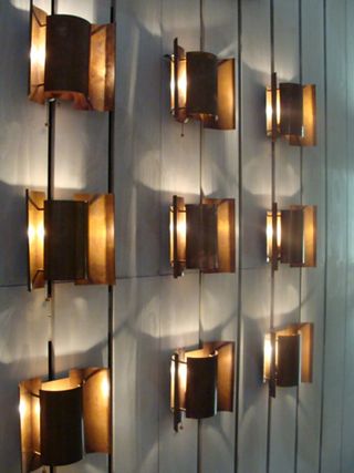 Copper wall lights, by Sven Ivar Dysthe for Northern Lighting. Nine wall lights in three rows.