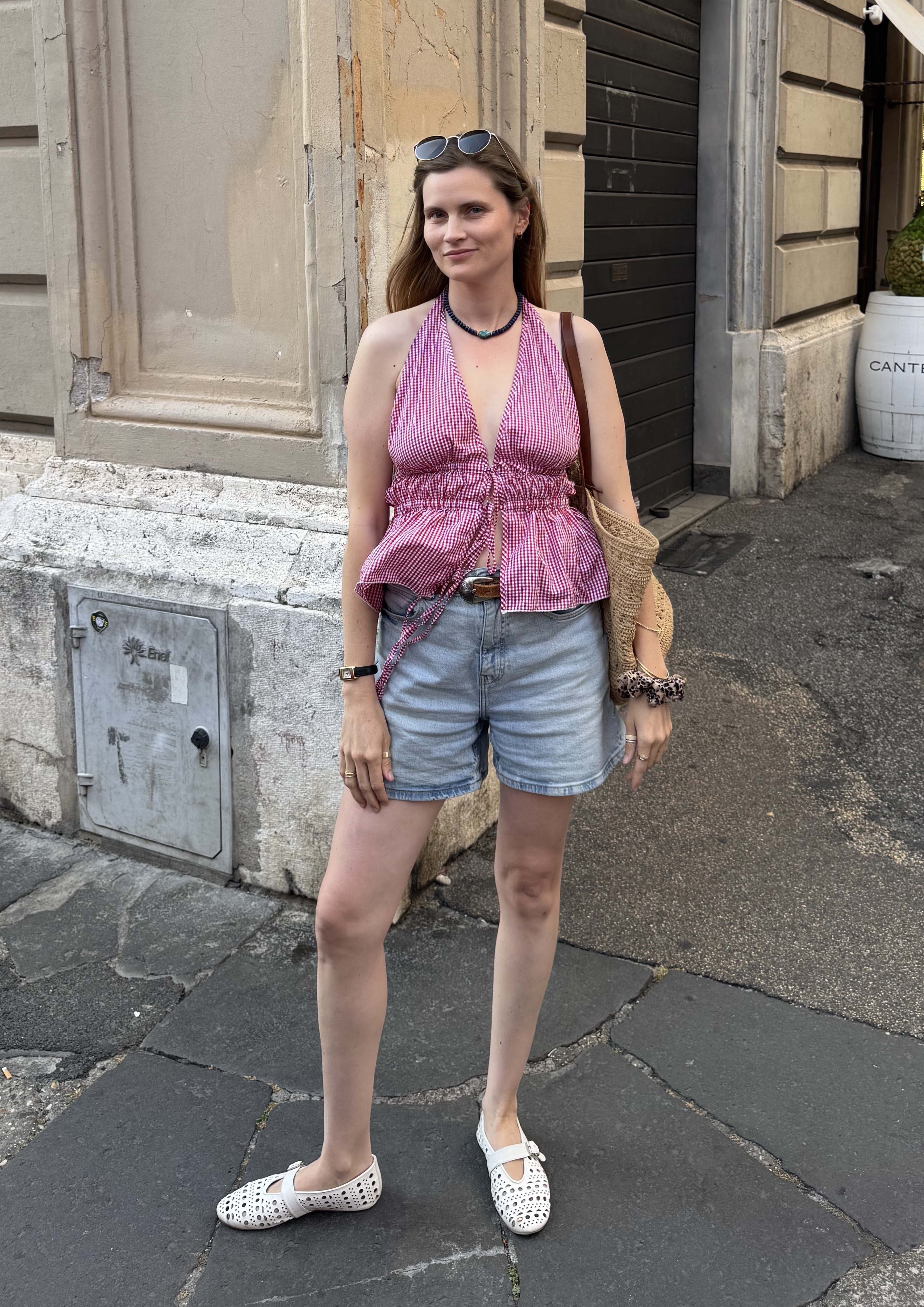 Eugenie Trochu wearing a summer top and shorts.