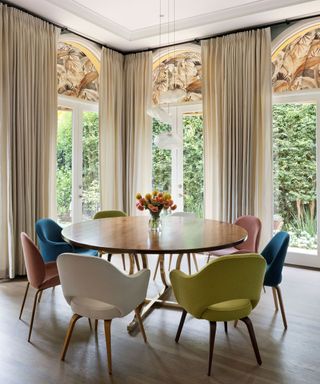 breakfast nook round table arched windows