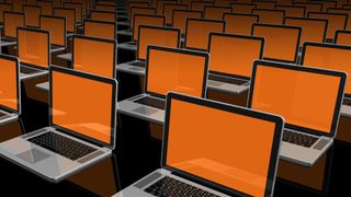 multiple laptops open with orange screen