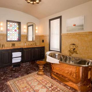 bathroom with golden bathtub