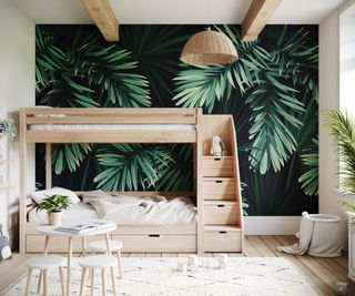 wooden bunkbeds with steps including drawers and bold green leafy wallpaper mural on wall