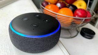 Amazon Echo Dot (3rd Gen) sitting next to a bowl of fruit