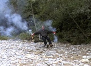 Man on a beach testing invention