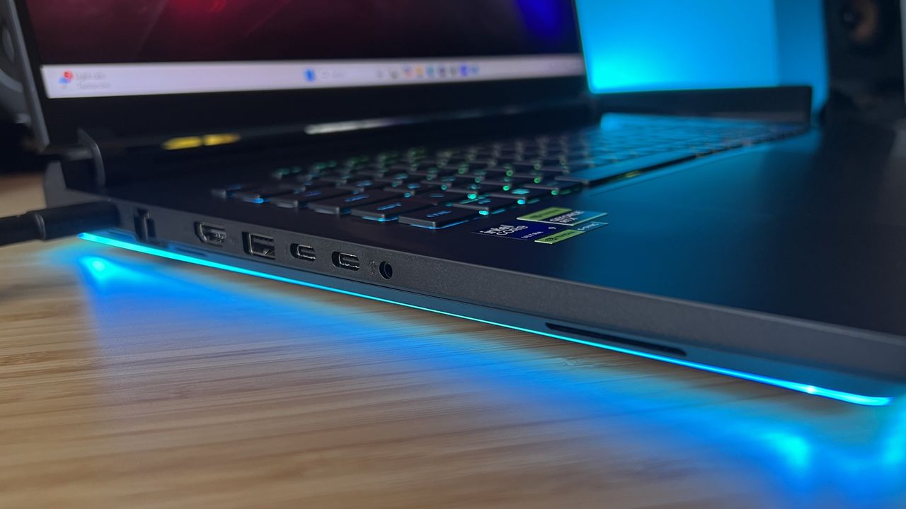 Side view of Asus ROG Strix Scar 18 showing left hand ports and RGB lighting