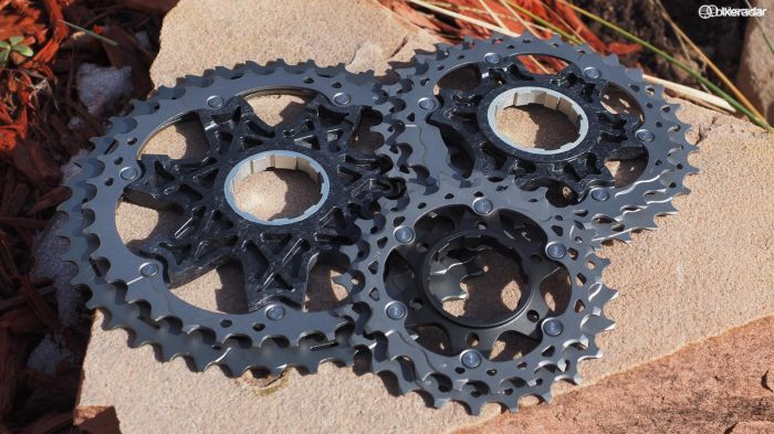For the bigger cogs, titanium rings are attached with stainless steel rivets to carbon composite spiders, which in turn have co-molded aluminum centers to precisely mate to the freehub body. The middle cogs are attached to aluminum carriers while the smallest cogs are made from forged steel