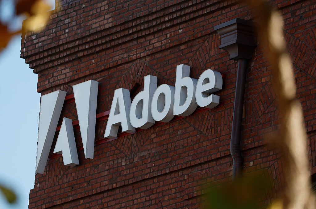 Quality stocks - Adobe name and logo on an office building