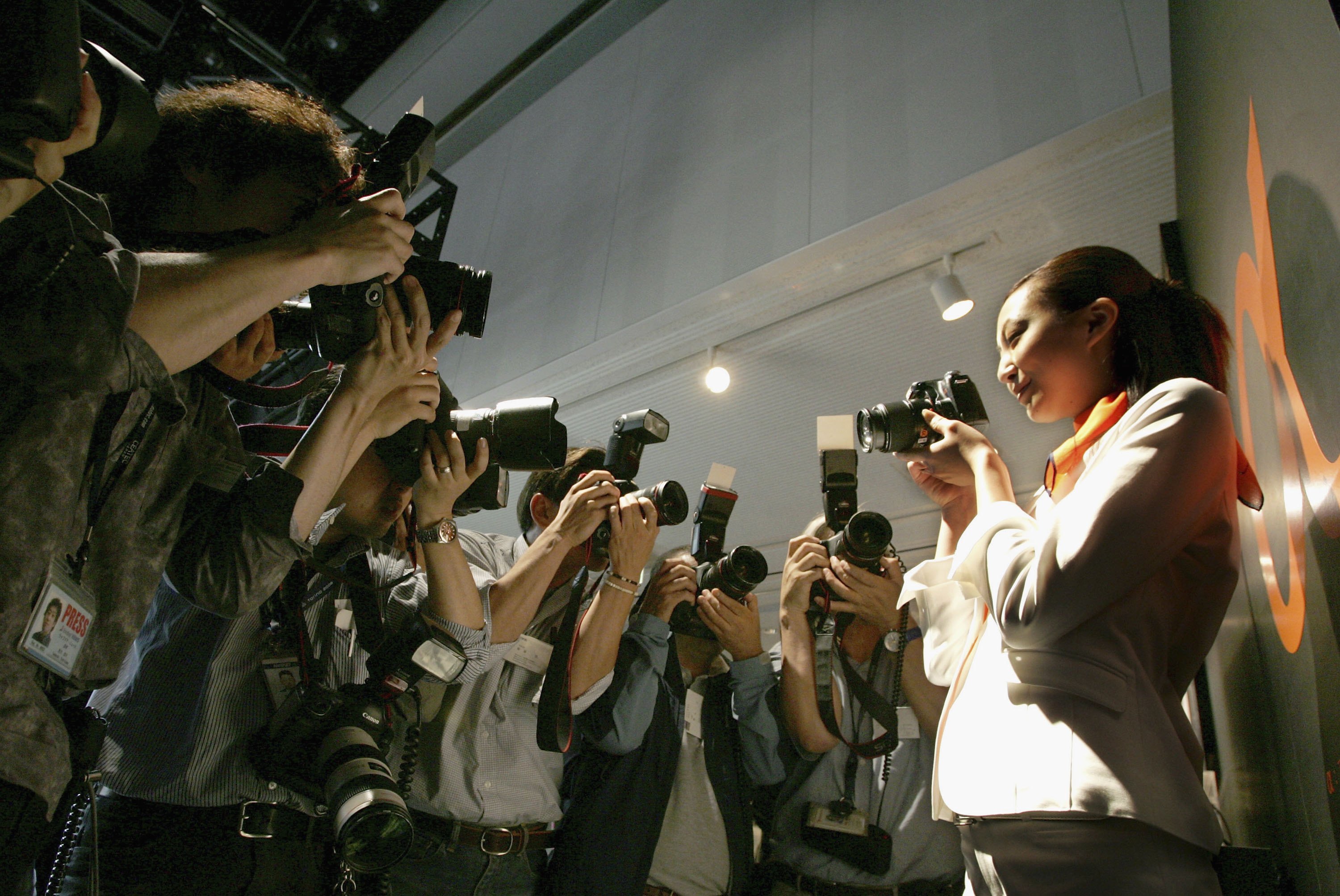 TOKYO, JAPAN - JUNE 6: A model shows off Sony&amp;amp;apos;s digital single-lens reflex (DSLF) camera Alpha "DSLR-A100" during a press conference on June 6, 2006 in Tokyo, Japan. This is Sony&amp;amp;apos;s first DSLF 10.2-megapixel with a 21 lens camera which will be released on July 21, 2006. (Photo by Junko Kimura/Getty Images)