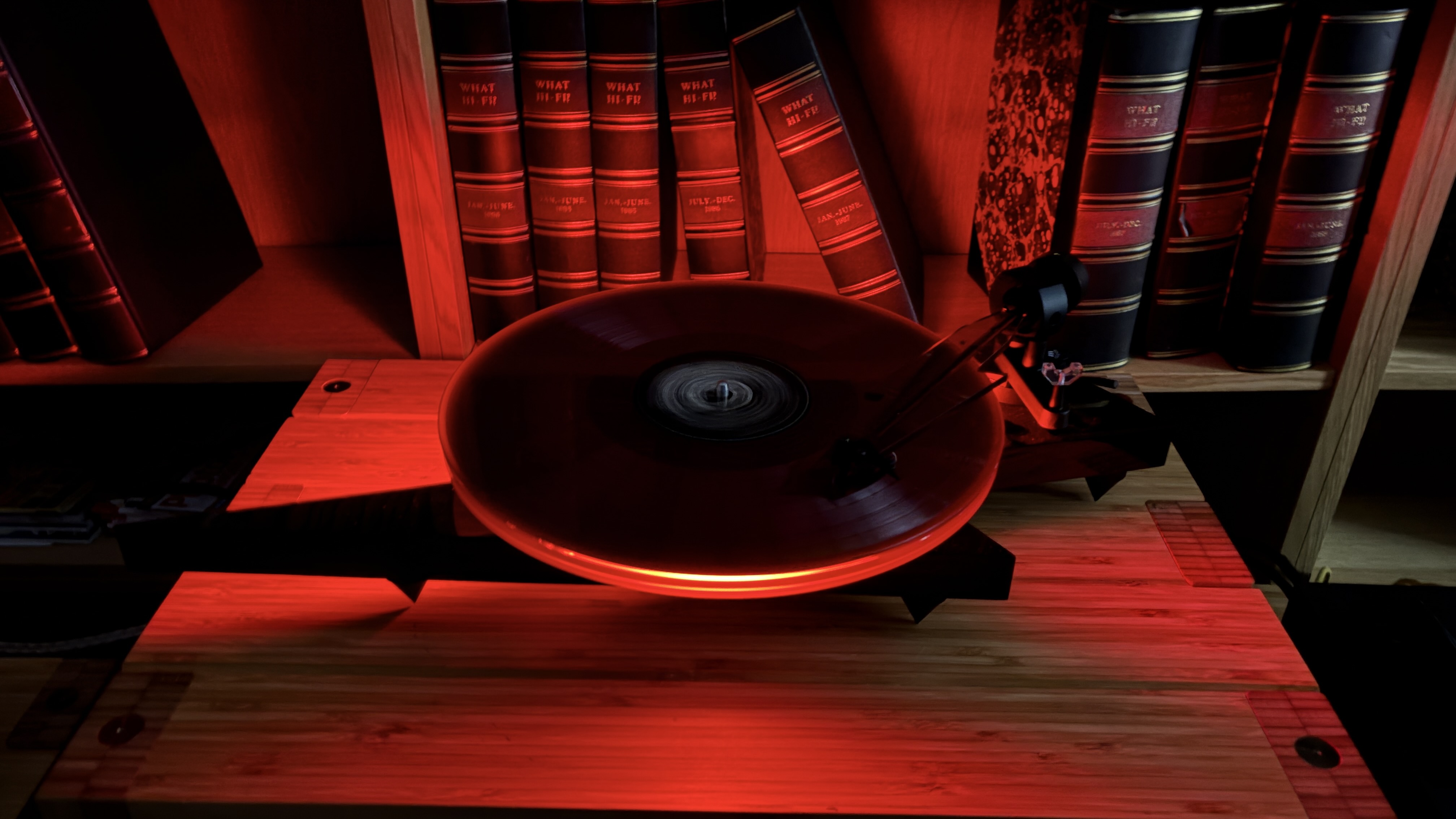 Pro-Ject AC/DC Turntable on wooden hi-fi rack