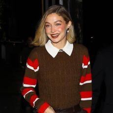 Gigi Hadid wearing a brown sweater vest