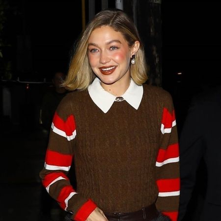 Gigi Hadid wearing a brown sweater vest