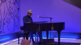 Joe Gardner playing piano at Pixar Place Hotel
