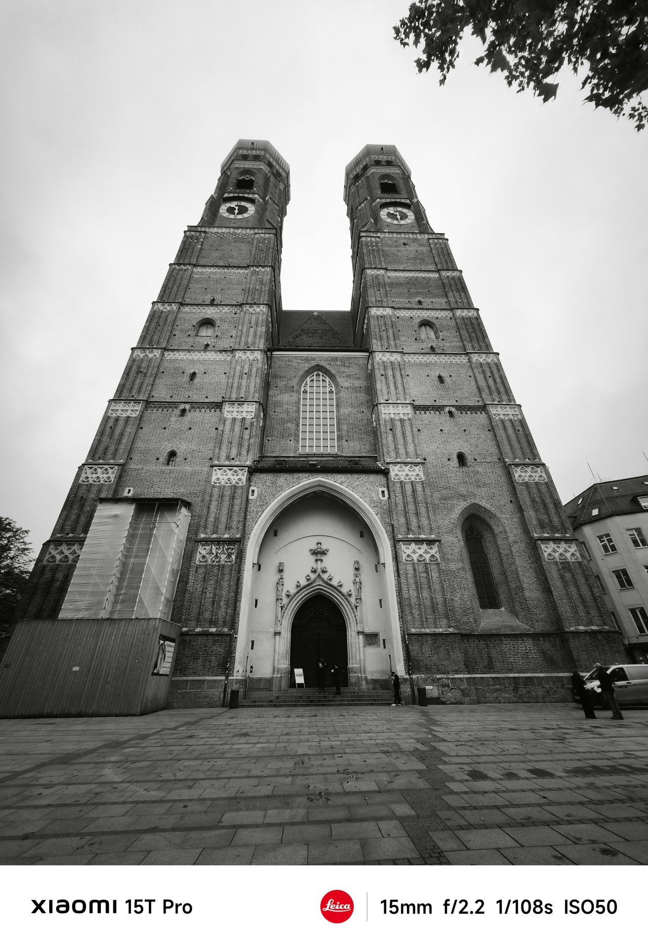 A church with two tall spires seen from ground level