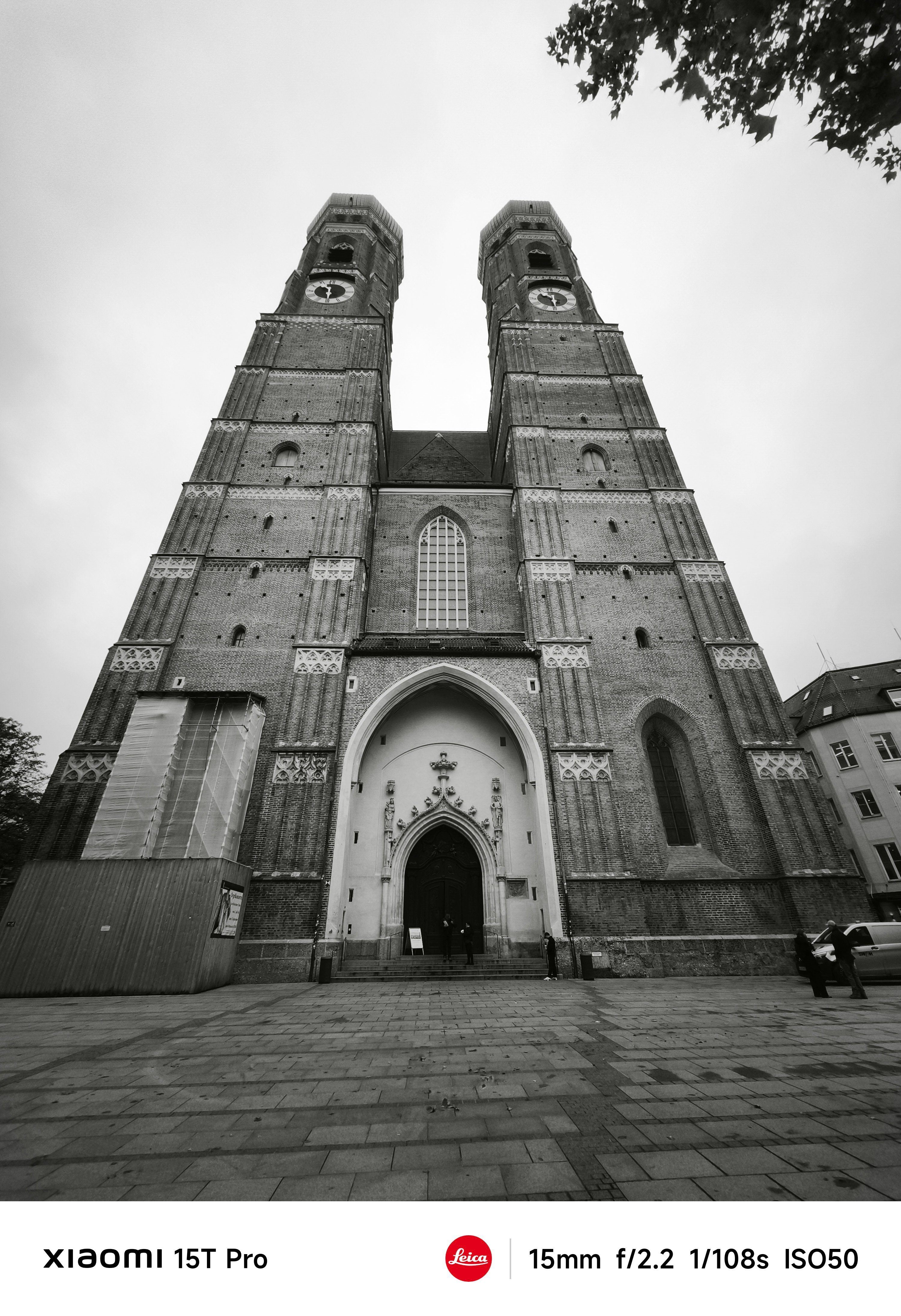 A church with two tall spires seen from ground level