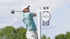 Scottie Scheffler hits his tee shot on the 10th hole during the third round of the PGA Championship