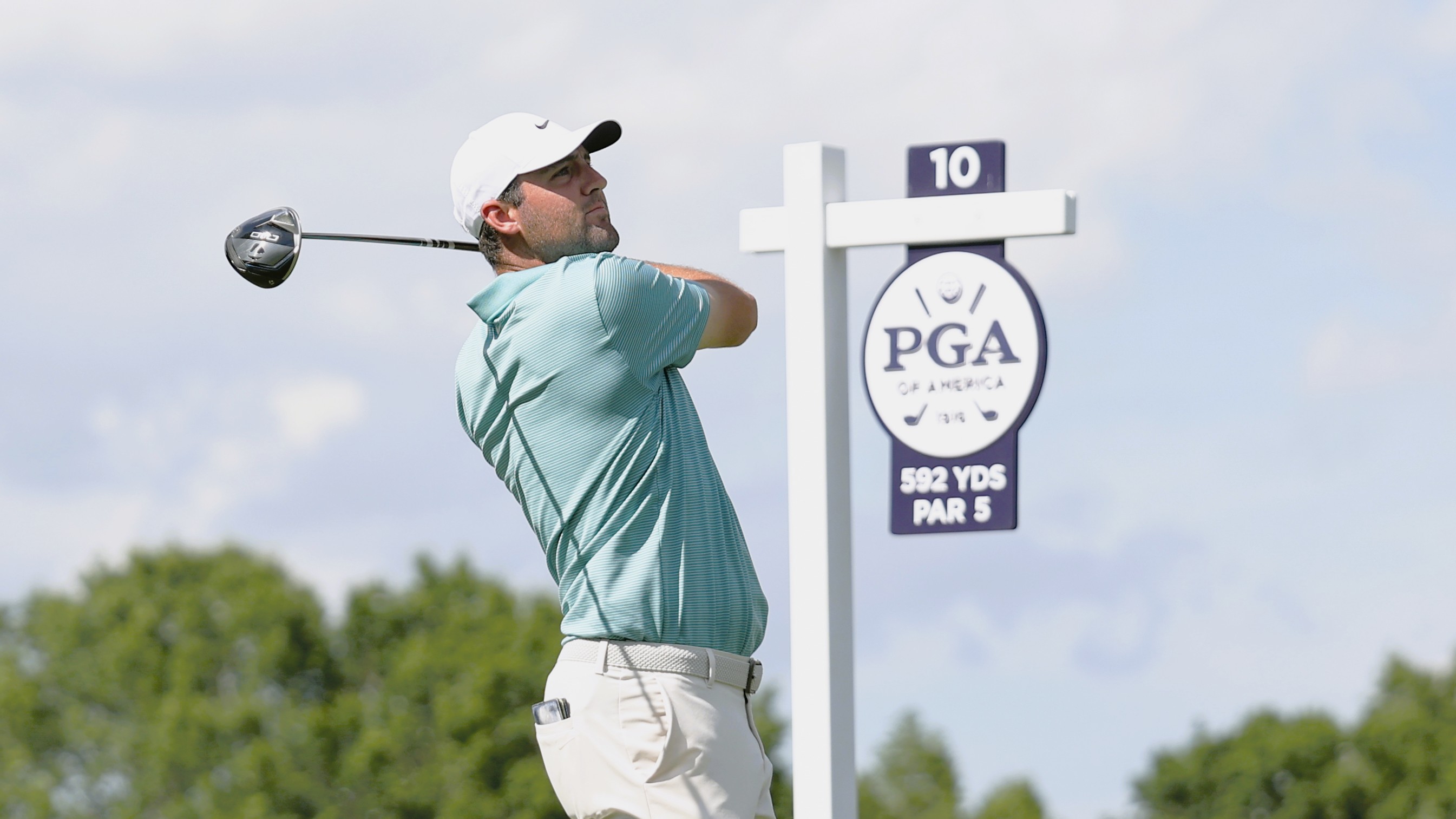 Scottie Scheffler hits his tee shot on the 10th hole during the third round of the PGA Championship 