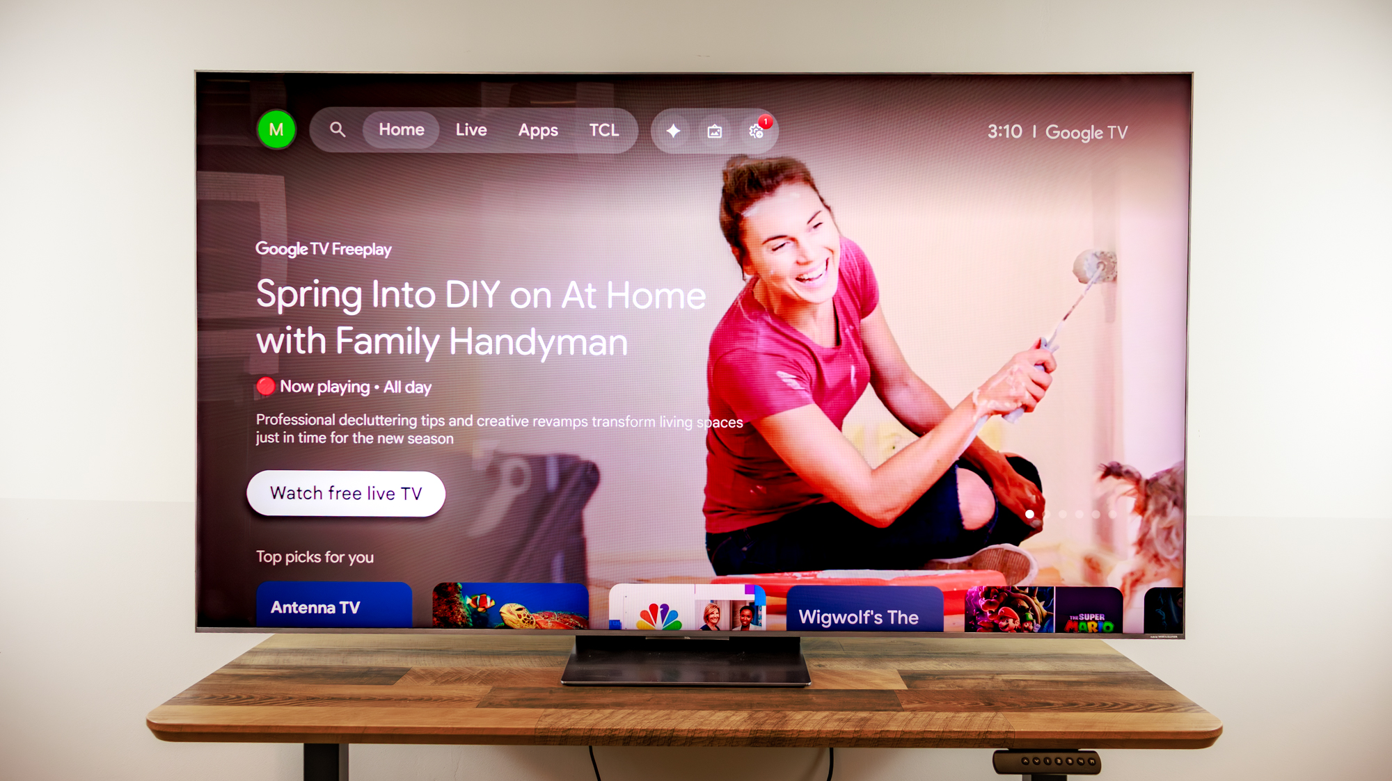 A TCL QM8L TV on a desk