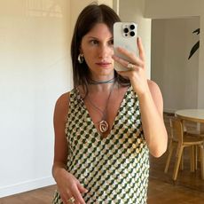 @laurareilly___ wearing green printed tank dress and long necklace with gold pendant