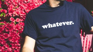 person with t-shirt that says 'whatever' on it