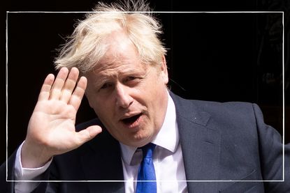 a close up of Boris Johnson waving at the cameras