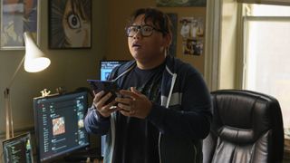 Jacob Batalon as Ned Leeds holding a smartphone in Spider-Man: Brand New Day