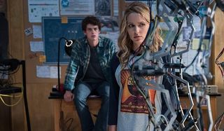 Happy Death Day 2U Jessica Rothe looks at the science project with worry