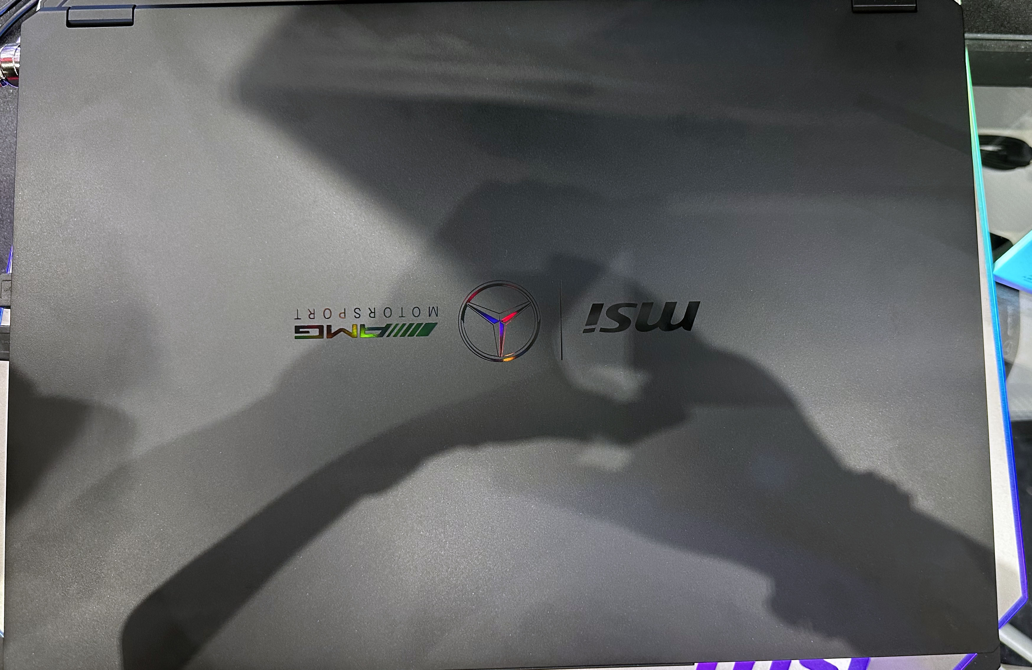 Close-up of the MSI Stealth 18 Mercedes-AMG Motorsport laptop lid branding at Computex