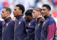 England line up before kick-off, including Jude Bellingham and Cole Palmer.