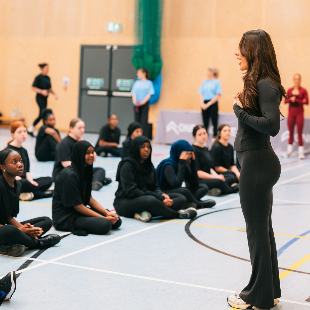 Entrepreneur Krissy Cela at a school giving a Project Power workshop, encouraging young girls into movement