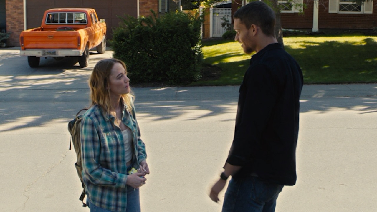 Maika Monroe and Tyriq Withers facing each other in Reminders of Him