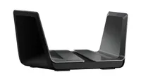 Netgear Nighthawk AX8 wireless router shown in gunmetal grey colorway and on a white background