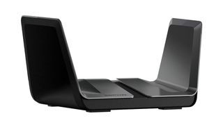 Netgear Nighthawk AX8 wireless router shown in gunmetal grey colorway and on a white background