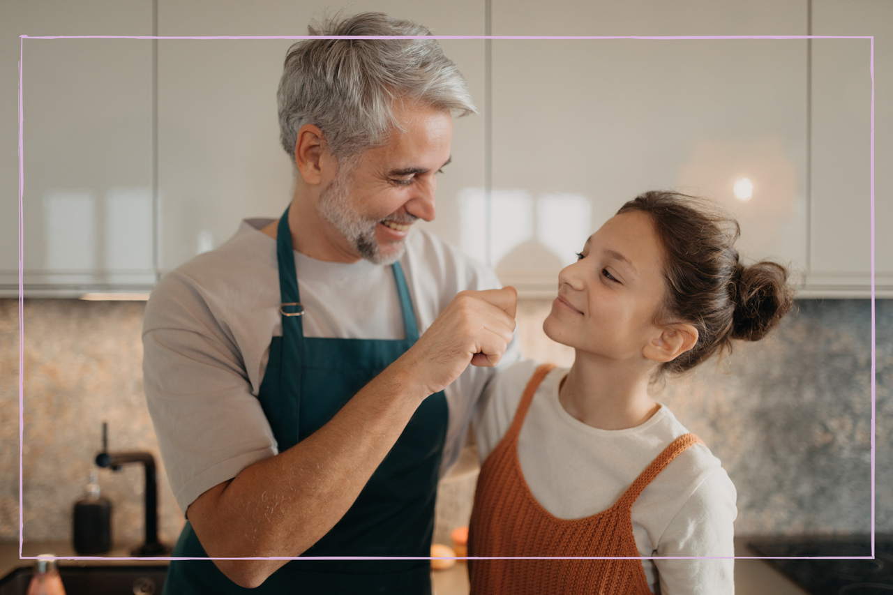 Teenage girl with his father in kitchen together