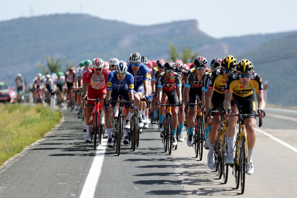 ESPINOSA DE LOS MONTEROS SPAIN AUGUST 16 LR Emmanuel Morin of France and Team Cofidis Fabio Jakobsen of Netherlands and Bert Van Lerberghe of Belgium and Team Deceuninck QuickStep compete during the 76th Tour of Spain 2021 Stage 3 a 2028km stage from Santo Domingo de Silos to Espinosa de los Monteros Picn Blanco 1485m lavuelta LaVuelta21 CapitalMundialdelCiclismo on August 16 2021 in Espinosa de los Monteros Spain Photo by Gonzalo Arroyo MorenoGetty Images