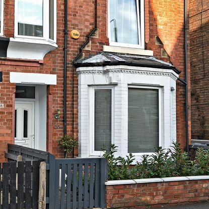 red brick house with small garden