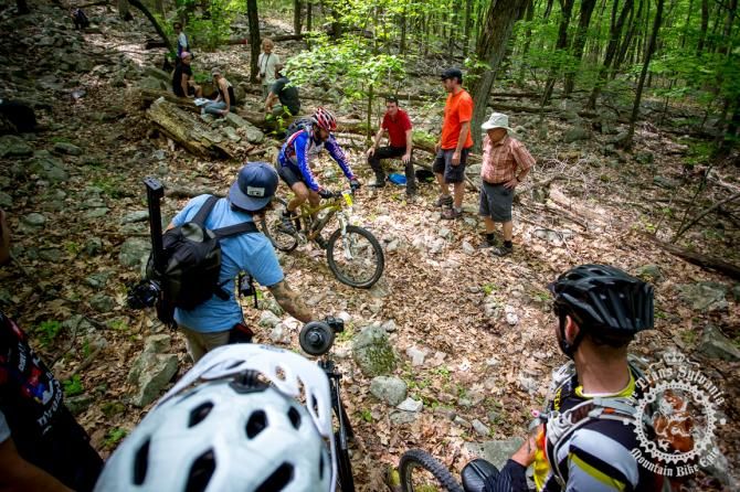 Erik Eiseman pulls through a group of spectators at the bottom of Wildcat Gap