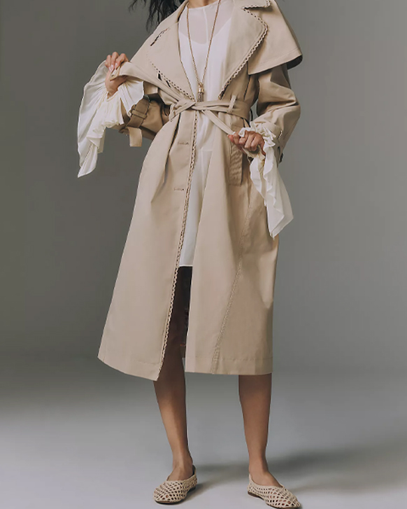 model wearing an Anthropologie trench coat