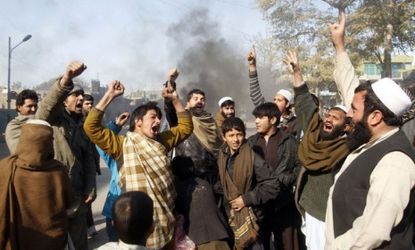 Afghan men shout anti-U.S. slogans during a demonstration