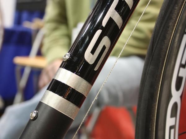 Strong's down tube logo shows off the underlying material.