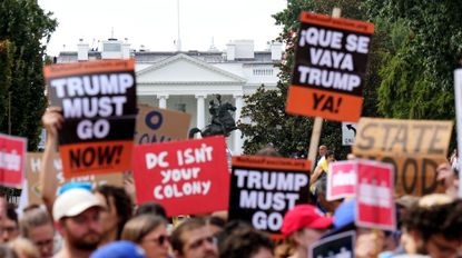 WASHINGTON, DC - AUGUST 11: People participate in a rally against the Trump Administration's federal takeover of the District of Columbia, outside of the AFL-CIO on August 11, 2025 in Washington, DC. President Trump announced he is placing the DC Metropolitan Police Department under federal control, and will deploy the National Guard to the District in order to assist in crime prevention in the nation&rsquo;s capital. 