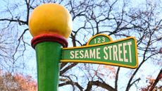 side shot of the sesame street street sign at the 2023 Macy's Thanksgiving Day parade