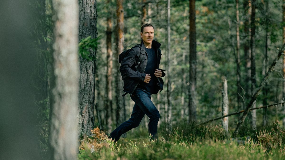 Martian (Michael Fassbender) walking through the woods in Paramount Plus&#039; &quot;The Agency&quot;