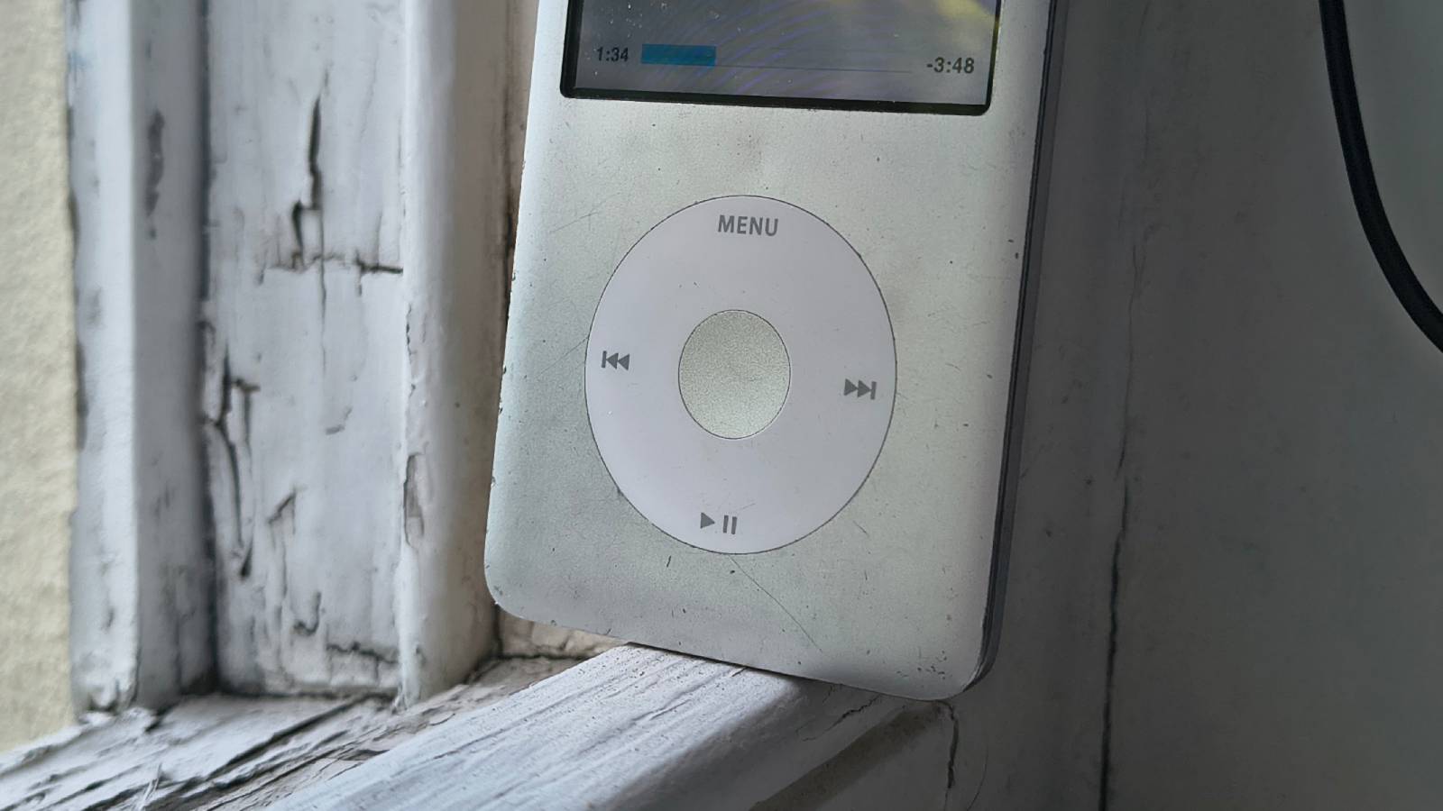 The iPod Classic on a window sill.