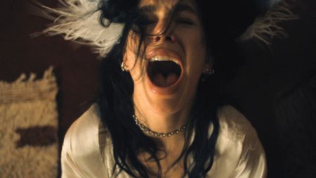 Rachel screams with her eyes closed