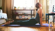 Woman practicing yoga in a domestic setting