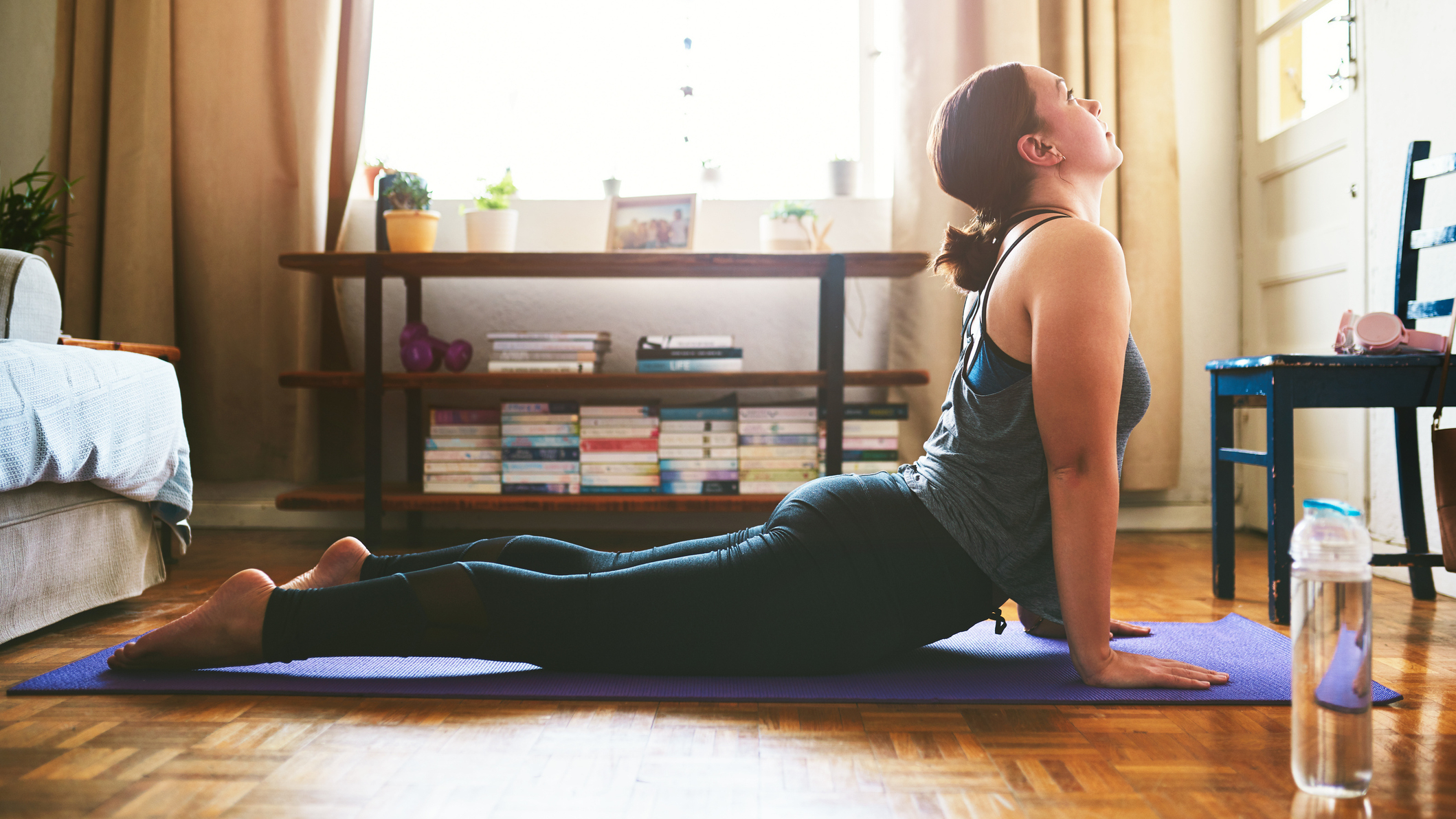 Woman practicing yoga in a domestic setting